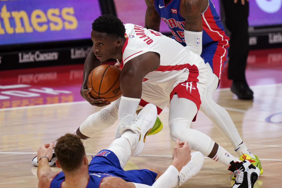 Houston Rockets guard Victor Oladipo (7) controls the ball after running into Detroit Pistons forward Blake Griffin during the second half of an NBA basketball game, Friday, Jan. 22, 2021, in Detroit. (AP Photo/Carlos Osorio)