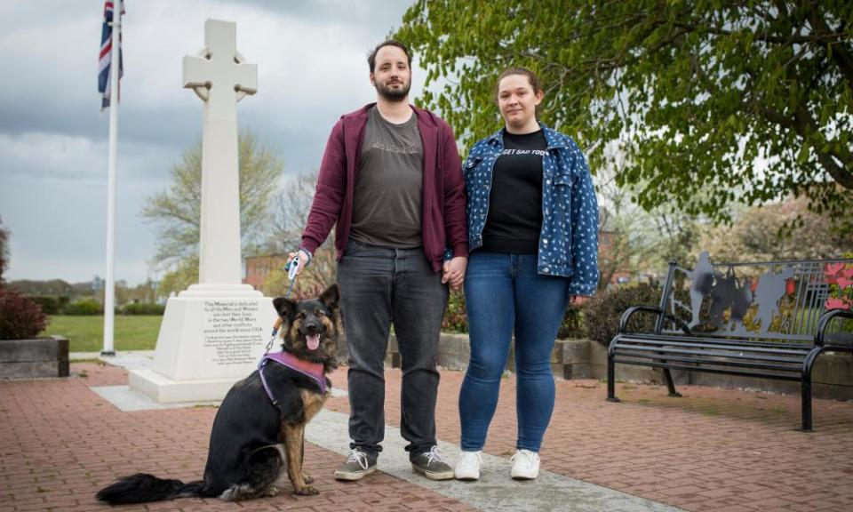 Sam and Kira Mandon-Jones with their dog Mocha in Market Place, Aylesham, Kent.