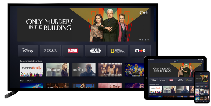 television screen and mobile tablet showing disney plus streaming service