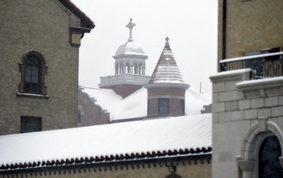 Buildings are blanketed in snow at the Archdiocese of Denver campus on Wednesday, Jan. 18, 2023. The archdiocese is being sued by a man who alleges about 100 instances of abuse at St. Elizabeth Ann Seton Church in Fort Collins, Colo., from 1998 to 2003. The lawsuit is allowed under a 2021 state law that opened up a three-year window for people to pursue litigation for sexual abuse that happened to them as children dating as far back as 1960. (AP Photo/Thomas Peipert)