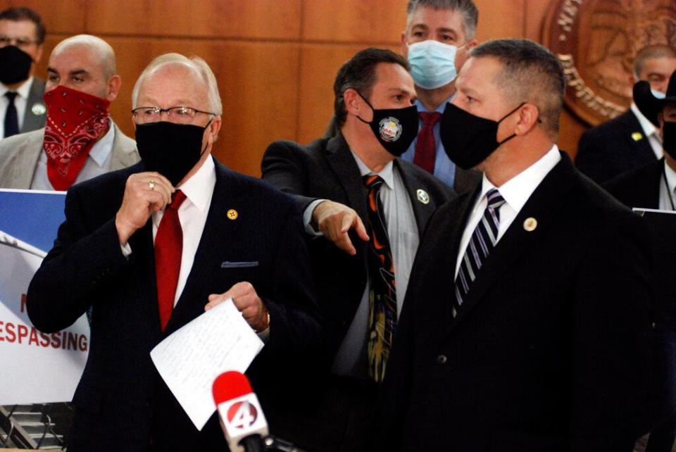 New Mexico Republican state legislators including House Minority Leader Jim Townsend of Artesia, left foreground, and Senate Minority Leader Gregory Baca of Belen, right, hold a news conference at the Capitol on Saturday, March 20, 2021, in Santa Fe.