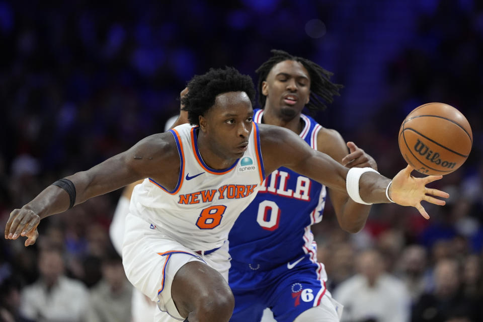 New York Knicks' OG Anunoby, left, steals the ball from Philadelphia 76ers' Tyrese Maxey during the first half of Game 3 in an NBA basketball first-round playoff series, Thursday, April 25, 2024, in Philadelphia. (AP Photo/Matt Slocum)
