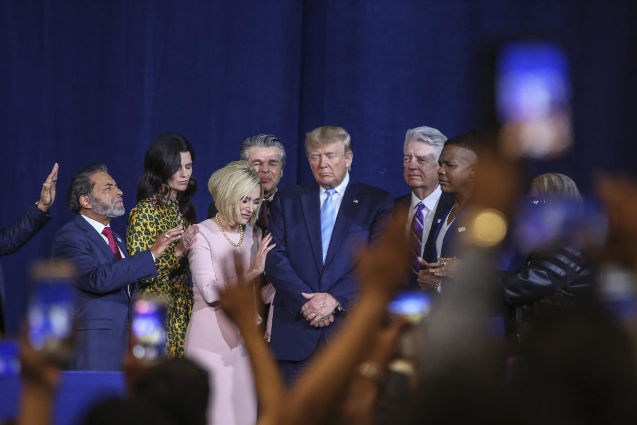 Religious leaders pray over President Trump before he addresses the congregation at the El Rey Jesus church. President Donald Trump holds an Evangelicals for Trump rally at the El Rey Jesus megachurch in south Miami to show up support among his evangelical base in the key swing state of Florida. (Adam DelGiudice/Echoes Wire/Barcroft Media via Getty Images)