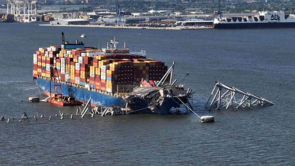 PHOTO: In this aerial view, a steel truss from the destroyed Francis Scott Key Bridge that was pinning the container ship Dali in place was detached from the ship using a controlled detonation of explosives in Baltimore, MD, May 13, 2024. (Chip Somodevilla/Getty Images)