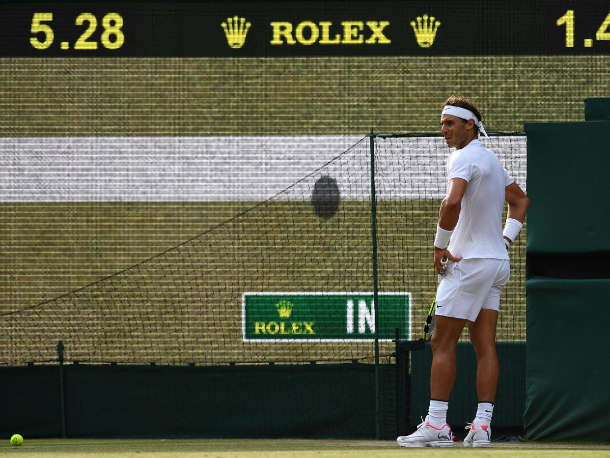 Rafael Nadal reacts after a Hawk-Eye decision goes against him at Wimbledon: Getty