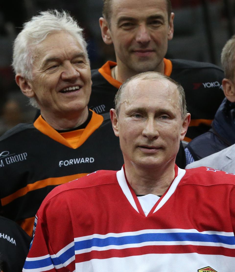 Sanctions SOCHI, RUSSIA - MAY 16: Russian President Vladimir Putin (R) and businessman Gennady Timchenko (L) in action during a Nignt Hockey League match on May 16, 2015 in Sochi, Russia. Putin was joined by fellow politicians, businessmen and retired NHL players. Putin's team won 18-6, with eight goals scored by Putin. (Photo by Sasha Mordovets/Getty Images)