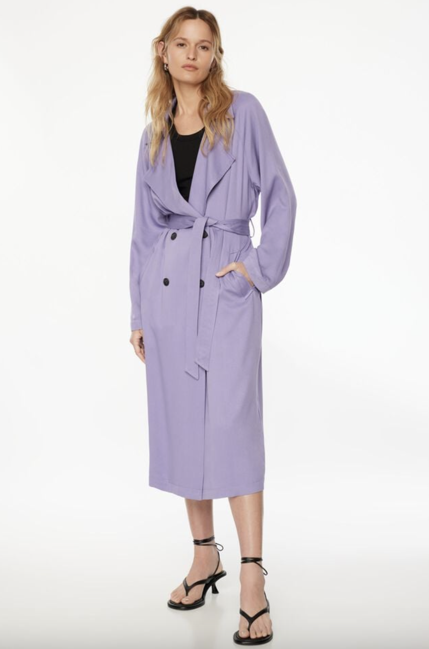 model wearing black sandals and Maxi Trench Jacket in Chalk Violet Purple (photo via Dynamite)