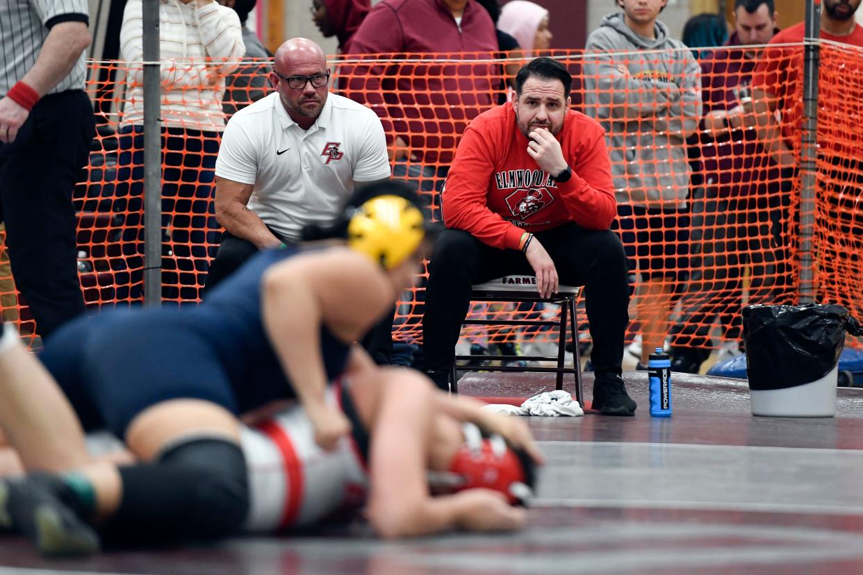 Elmwood Park head coach Tom Mulligan, right, and assistant coach Dennis Murri look on as Maria Taseva wrestles in the 180-pound final during the North Region girls wrestling tournament on Sunday, Feb. 23, 2020, in Union.