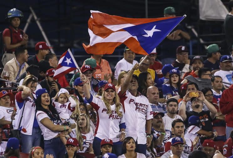 Yadier Molina of Puerto Rico celebrates a 3-1 victory against The