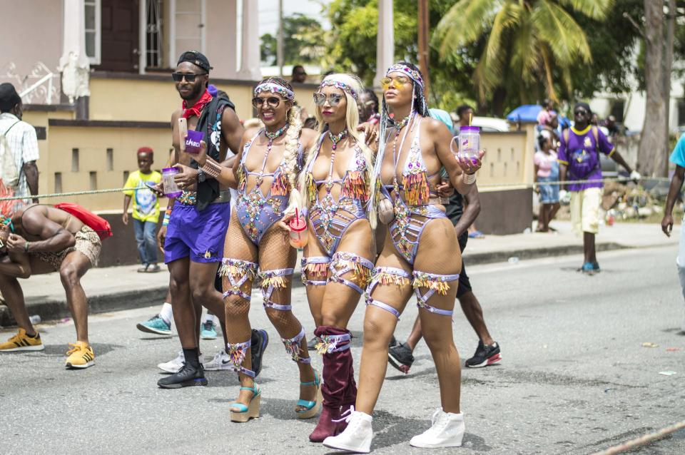 A beautiful coordinating moment amongst three friends rocking stunning pastel purple body suits with a statement headpiece to match.