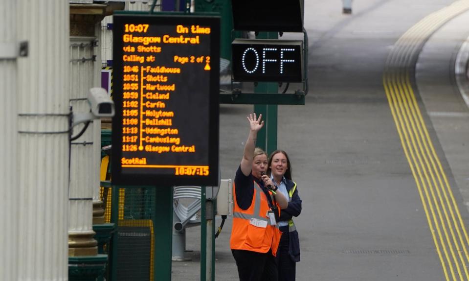 Train staff wave off a train at Waverley Station in Edinburgh, as train services continue to be disrupted following the nationwide strike. Boris Johnson called the strike a “terrible idea” (Andrew Milligan/PA) (PA Wire)