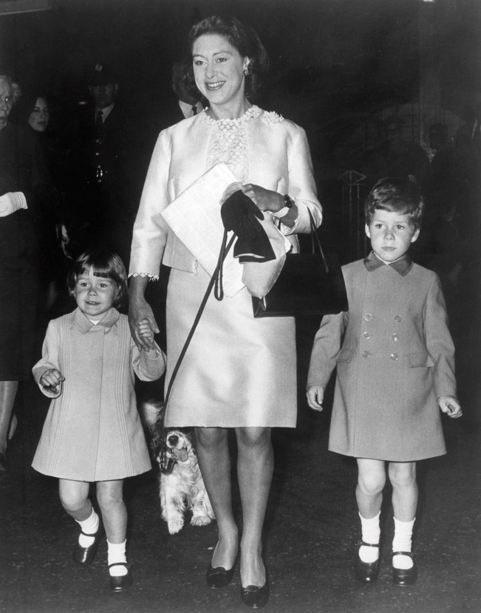 <p>Sarah, almost 2 years old here, holds her mother Princess Margaret's hand while arriving for an event in London with brother Linley (right).</p>