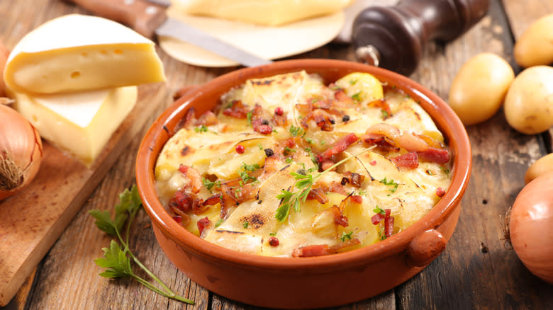 Tartiflette in clay dish