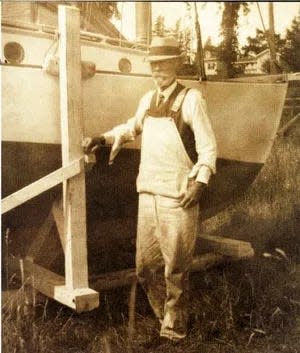 Maritime artist George S. Wasson of Kittery Point (1855-1932) stands next to his boat, the Bonnie Doon. A free exhibit featuring Wasson's work opens Aug. 5 at the Portsmouth Athenaeum's Randall Gallery, 9 Market Square.