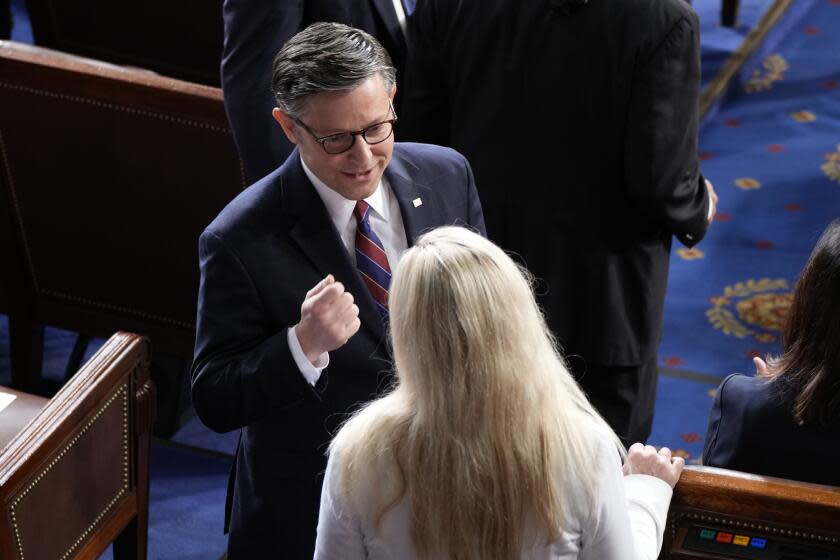 Speaker of the House Mike Johnson, R-La., talks with Rep. Marjorie Taylor Greene, R-Ga., before Japan's Prime Minister Fumio Kishida addresses a joint meeting of Congress in the House chamber, Thursday, April 11, 2024, at the Capitol in Washington. (AP Photo/Jacquelyn Martin)