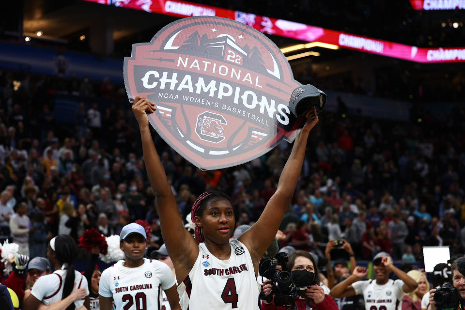 MINNEAPOLIS, MINNESOTA - APRIL 03: Aliyah Boston #4 of the South Carolina Gamecocks holds a national champions sign after defeating the UConn Huskies 64-49 during the 2022 NCAA Women's Basketball Tournament National Championship game at Target Center on April 03, 2022 in Minneapolis, Minnesota. (Photo by Elsa/Getty Images)