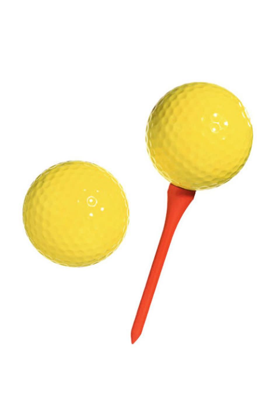 summer activities two yellow golf balls and a golf tee