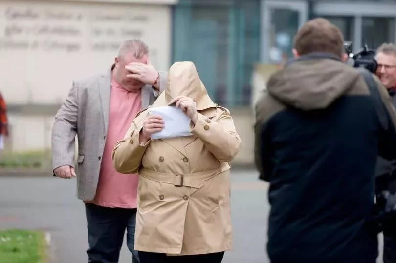 Bernard McDonagh (left) and Ann McDonagh (centre) both covered their faces as they were spotted by members of the media arriving at court