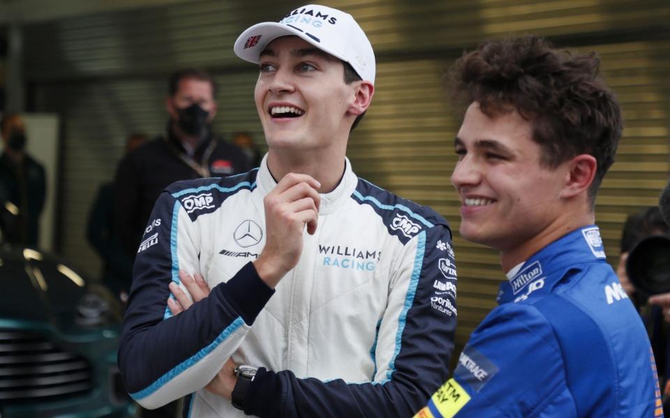 British Formula One drivers George Russell (L) of Williams Racing and Lando Norris (R) of McLaren F1 Team react after the qualifying session of the 2021 Formula One Grand Prix of Russia at the Sochi Autodrom race track in Sochi, Russia, 25 September 2021. Norris took pole position ahead of third placed Russell. The Formula One Grand Prix of Russia will take place on 26 September 2021. Formula One Grand Prix of Russia, Sochi, Russian Federation - Yuri Kochetkov/POOL/EPA-EFE/Shutterstock 