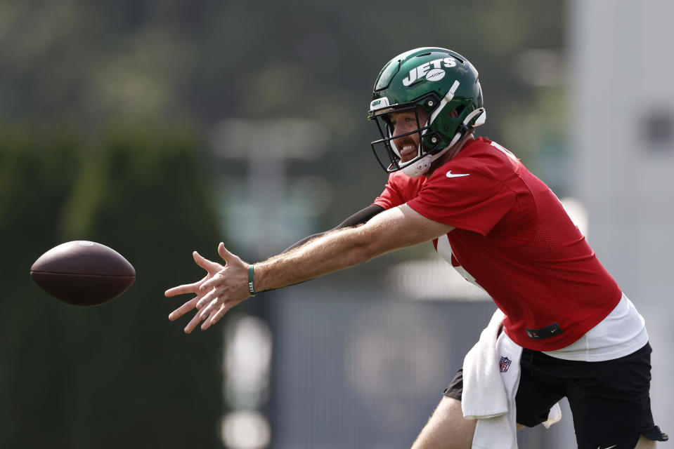 New York Jets quarterback James Morgan tosses the ball during NFL football practice Wednesday, July 28, 2021, in Florham Park, N.J. (AP Photo/Adam Hunger)