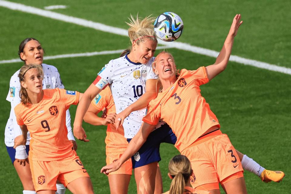 Netherlands' defender Stefanie van der Gragt (R) and USA's midfielder #10 Lindsey Horan (C) fight for the ball during the 2023 Women's World Cup Group E football match between the United States and the Netherlands on July 27, 2023.