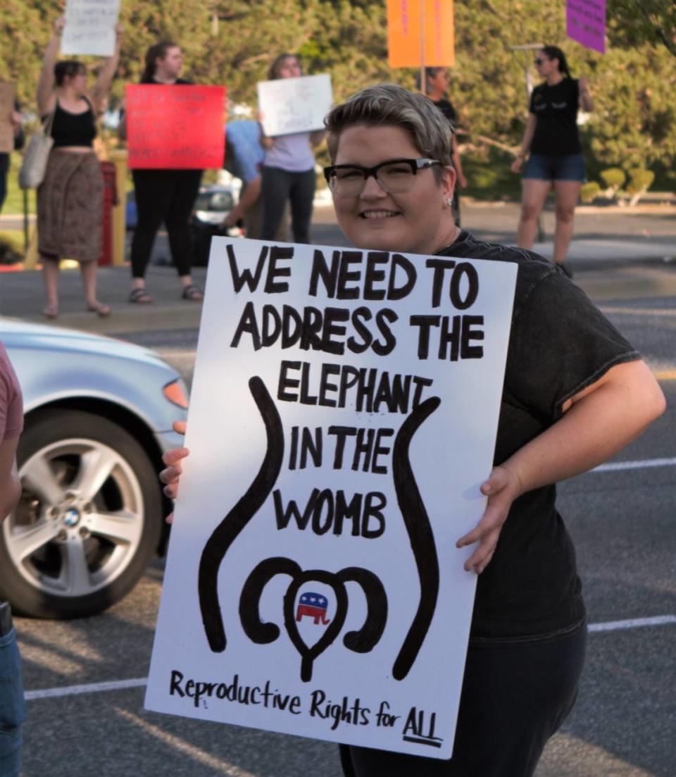A protester shows off their sign during a demonstration in support of abortion rights along George Washington Way near Jon Dam Plaza in Richland on May 4, 2022.