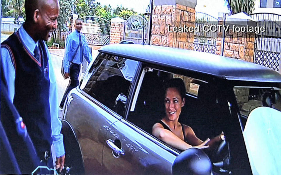 FILE - In this frame grab from CCTV footage leaked to M-Net's Carte Blanche program which viewed Sunday Feb 24, 2013, shows Reeva Steenkamp entering the secured access to the Silverwoods housing estate, home of Olympian athlete Oscar Pistorius, some hours before she was shot and killed at Pistorius' home. Ahead of Pistorius' trail, for the shooting death starting Monday, March 3, 2014, legal experts say Pistorius would still be vulnerable to a homIcide conviction even if he is acquitted of murdering Steenkamp. (AP Photo/M-Net Carte Blanche, File)