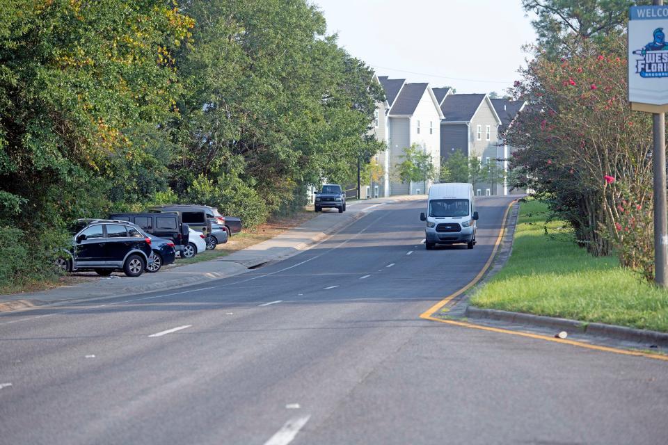 Overflow parking by residents and guests spills out along University Parkway on Thursday, Aug. 24, 2025. Escambia County leaders are considering a parking plan to address the issue.
