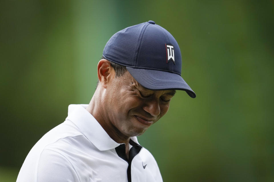 Tiger Woods grimaces on the fourth tee during the first round of the Masters golf tournament at Augusta National Golf Club on Thursday, April 6, 2023, in Augusta, Ga. (AP Photo/Matt Slocum)