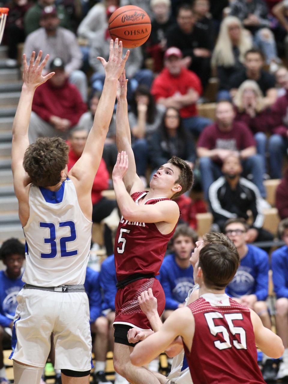 Newark's Grant Burkholder shoots over Olentangy Liberty's Tyler Kropp.