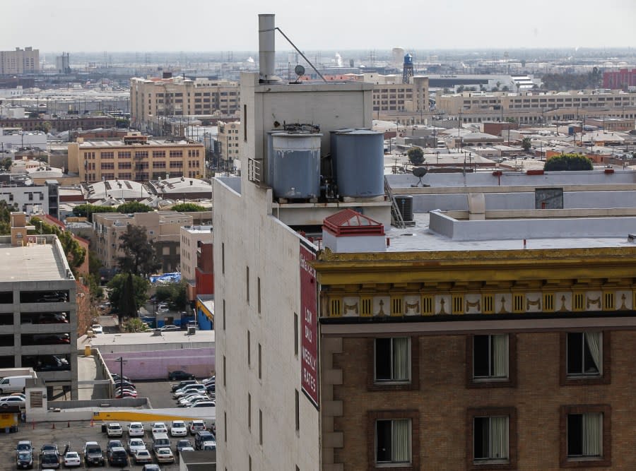 This Thursday, Feb. 21, 2013 photo shows water tanks on the roof of the Cecil Hotel in Los Angeles Thursday, Feb. 21, 2013. Canadian tourist Elisa Lam had been missing for about two weeks when officials at the Cecil Hotel found her body in a water cistern on the hotel roof. Guest complaints about low water pressure prompted a maintenance worker to make the gruesome discovery Tuesday, and officials were trying to determine if the 21-year-old was killed or if her death was a bizarre accident. (AP Photo/Damian Dovarganes)