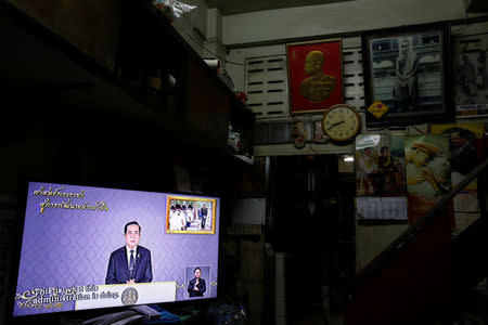 Thailand Prime Minister Prayuth Chan-ocha is seen on a TV during his weekly broadcast in Bangkok, Thailand, May 19, 2017. Picture taken May 19, 2017 REUTERS/Jorge Silva