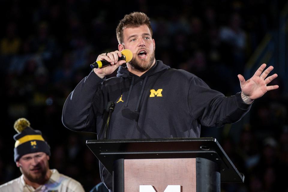 Michigan offensive lineman Trevor Keegan speaks during the national championship celebration at Crisler Center in Ann Arbor on Saturday, Jan. 13, 2024.