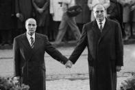 On September 22, 1984 in Douamont, near Verdun, then French President Francois Mitterrand (L) and German Chancellor Helmut Kohl symbolically held hands during the reconciliation ceremony