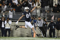 Penn State tight end Theo Johnson (84) scores a touchdown during the first half of an NCAA college football game against Michigan State, Saturday, Nov. 26, 2022, in State College, Pa. (AP Photo/Barry Reeger)