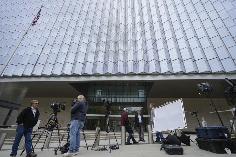Members of the media wait outside federal court, Wednesday, May 22, 2024, in Los Angeles. Hunter Biden's lawyers are pressing a judge to delay his federal tax trial set to begin next month in Los Angeles. (AP Photo/Damian Dovarganes)