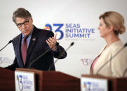 Croatian President Kolinda Grabar-Kitarovic, right, looks on as U.S. Energy Secretary Rick Perry speaks during a press conference at the Three Seas Initiative Business Forum in Bucharest, Romania, Tuesday, Sept. 18, 2018. U.S. President Donald Trump has reaffirmed Washington's support for a business summit that aims to boost connectivity in Eastern Europe and improve ties between the region and the U.S. and European Union. (AP Photo/Vadim Ghirda)