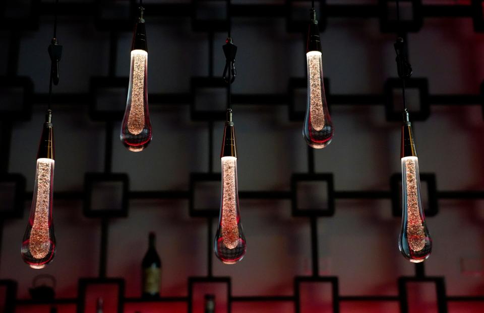 Pendant lighting at Baru. The lights can change color and move up and down at various speeds.
