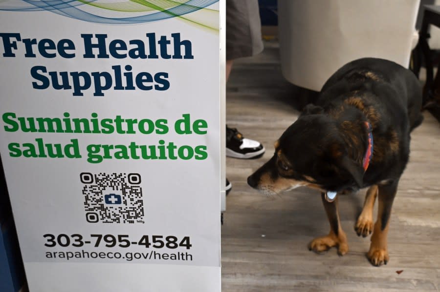 The dog who greets visitors at the community partner in Englewood sniffs the new Health Supply Kiosk curiously. As Arapahoe County Public Health staff stocked the machine with supplies, she oversaw the operation, then resumed her post as greeter of all visitors who come to seek services at the organization.