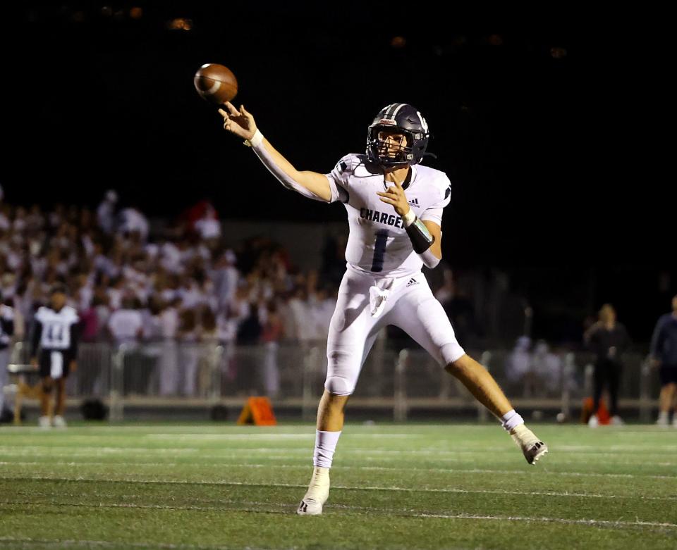 Corner Canyon’s Isaac Wilson passes the ball as Corner Canyon and Lone Peak play at Lone Peak on Friday, Oct. 7, 2022.