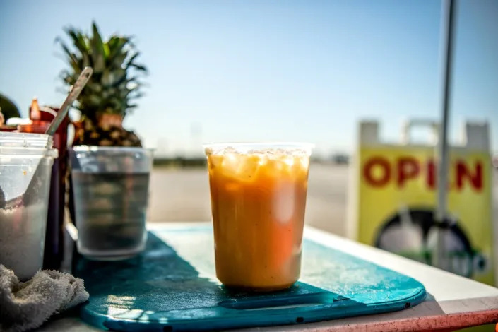 A cup of tejuino on a tray.