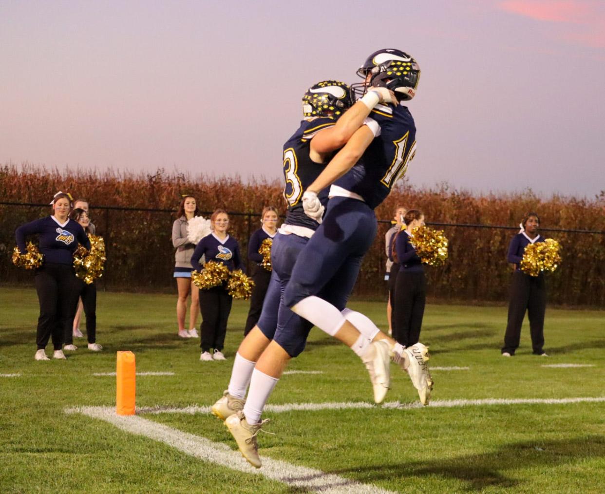 River Valley's Brock Mosher, right, and Will Garrison celebrate a touchdown during a football game against Marion Harding earlier this season.