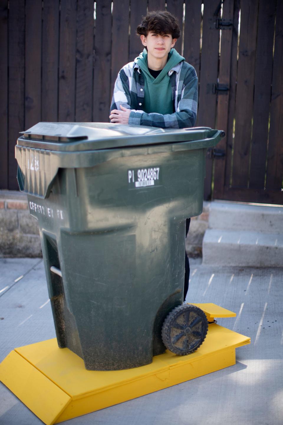 Damian Earley, 17, received a patent from U.S. Patent and Trademark Office for The Garbage Lot, a locking platform that uses sand or water to weigh down a garbage or recycling receptacle and prevent bins from tipping over and spilling debris into the street.