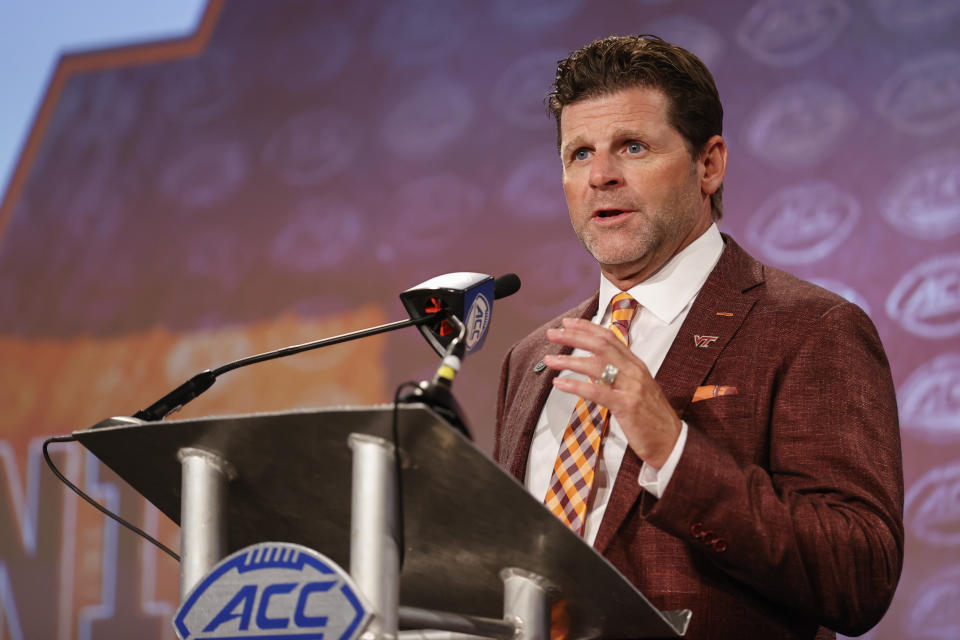 Virginia Tech head coach Brent Pry answers a question at the NCAA college football Atlantic Coast Conference Media Days in Charlotte, N.C., Thursday, July 21, 2022. (AP Photo/Nell Redmond)