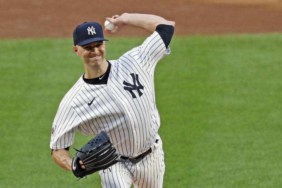 New York Yankees starting pitcher J.A. Happ winds up during the first inning of a baseball game against the Boston Red Sox, Sunday, Aug. 16, 2020, in New York. (AP Photo/Kathy Willens)