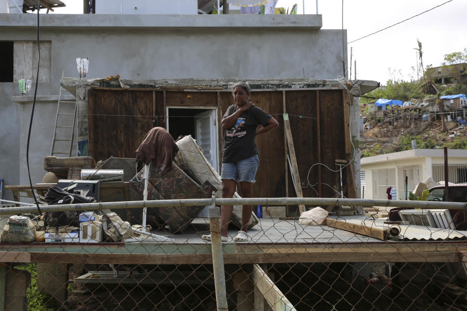 A woman stands in the middle of what used to be her home in Can&oacute;vanas, Puerto Rico, on Oct. 14, 2017. (Photo: Carolina Moreno/HuffPost)