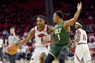 Arkansas guard JD Notae (1) tries to get past Charlotte guard Jahmir Young (1) during the first half of an NCAA college basketball game Tuesday, Dec. 7, 2021, in Fayetteville, Ark. (AP Photo/Michael Woods)