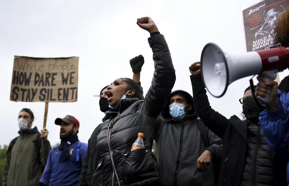 Protestors shout in Hyde Park during protests in London, Friday, June 12, 2020 in response to the recent killing of George Floyd by police officers in Minneapolis, USA, that has led to protests in many countries and across the US.(AP Photo/Alberto Pezzali)