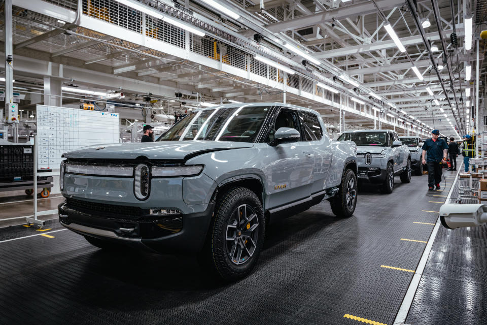 Rivian electric pickup trucks on the assembly line.