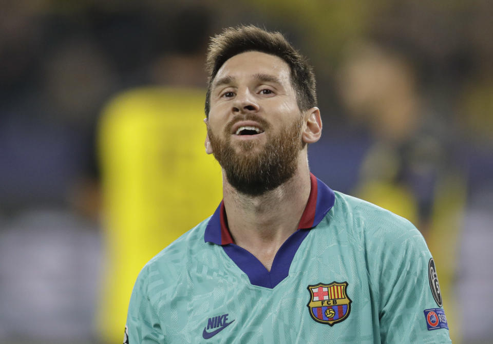 Barcelona's Lionel Messi smiles at the end of the Champions League Group F soccer match between Borussia Dortmund and FC Barcelona in Dortmund, Germany, Tuesday, Sept. 17, 2019. (AP Photo/Michael Probst)